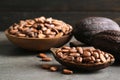 Cocoa pods and beans on table Royalty Free Stock Photo