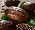 Cocoa pods and cocoa beans on the wooden table