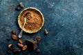 Cocoa powder, beans and dark chocolate pieces crushed, culinary background Royalty Free Stock Photo