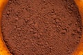 cocoa powder in a bowl shot on a macro lens, powder for making chocolate. Royalty Free Stock Photo