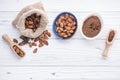 Cocoa powder and cacao beans on wooden background Royalty Free Stock Photo