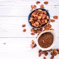 Cocoa powder and cacao beans on wooden background Royalty Free Stock Photo