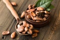 Cocoa powder and cacao beans on wooden background. Dark chocolate pieces crushed and aromatic herbs . Royalty Free Stock Photo