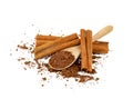 Cocoa powder and cinnamon sticks  with wooden spoon isolated on white background Royalty Free Stock Photo