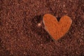 Cocoa powder dusted heart shaped glass with grated chocolate Royalty Free Stock Photo