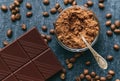 Cocoa powder, fresh fried coffee beans and chocolate bar Royalty Free Stock Photo