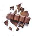 Cocoa powder and pieces of dark chocolatePieces of dark chocolate, isolated on white Royalty Free Stock Photo