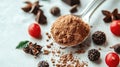 Cocoa powder in a spoon, surrounded by chocolate, spices, and berries Royalty Free Stock Photo