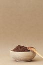 Cocoa powder in wooden bowl with wooden spoon Royalty Free Stock Photo