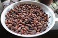 Cocoa seeds in a frying pan Royalty Free Stock Photo