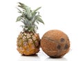 Cocoanut and pineapple on white Royalty Free Stock Photo