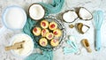 Coconut baking theme flat lay creative layout overhead with baked macaroons.