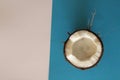 Sliced coconut on white and blue background Royalty Free Stock Photo