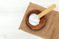 Coconut body cream on wooden background. Body care