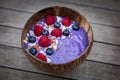 Coconut bowl with blueberries raspberries and coconut Royalty Free Stock Photo