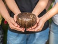 Coconut bowl on hands Royalty Free Stock Photo