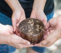 Coconut bowl on hands Royalty Free Stock Photo