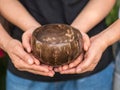 Coconut bowl on hands Royalty Free Stock Photo
