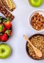 Coconut Bowls with Granola or Muesli with Wooden Spoon Bowl with Ripe Strawberry and Almond Green Apple Muesli Bars Blue Royalty Free Stock Photo