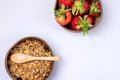 Coconut Bowls with Granola or Muesli with Wooden Spoon Bowl with Ripe Strawberry on Blue Background Healthy Diet Breakfast Top Royalty Free Stock Photo