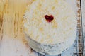 Coconut cake on aged wood white table