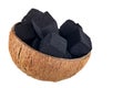 Coconut charcoal on a white background. Coconut coal cubes for hookah and coconut close-up. Side view. Royalty Free Stock Photo