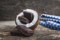 Coconut with chocolate on wooden background