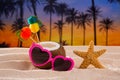 Coconut cocktail on tropical sand beach heart sunglasses Royalty Free Stock Photo