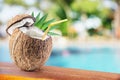 Coconut with cocnut milk on the bar table. Royalty Free Stock Photo