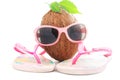 Coconut concept with sunglasses and beachwear