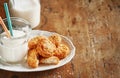 Coconut cookies with a bottle of coconut milk on a rustic background, space for text. Banner. Vegan healthy snack Royalty Free Stock Photo