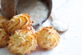 Coconut cookies macarons with copra on a white background