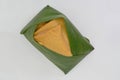 Coconut custard topped on glutinous sticky rice wrapped in banana leaves, khao niao sangkhaya, a popular Thai dessert