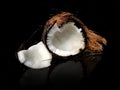 Coconut cut pice isolated on black background with reflation