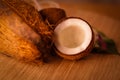 Coconut with fresh coco milk and powder on wooden table,healthy coconut milk with whole nut,coconut with leaves and flower,Cracked