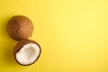 Coconut fruits on yellow plain background, abstract food tropical concept Royalty Free Stock Photo