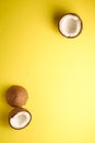 Coconut fruits on yellow plain background, abstract food tropical concept Royalty Free Stock Photo