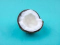 Coconut. Half isolated on blue background. Top view