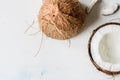 Coconut halves on white background top view