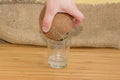 Coconut in hand during pouring out coconut water in glass Royalty Free Stock Photo