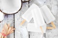 Coconut ice pops in a cluster over a white wood background Royalty Free Stock Photo