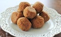 Coconut laddu on decorative white plate