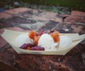 Coconut milk ice cream with red beans and sweet potato topping put on old brick wall at Sukhothai Loy Krathong festival.