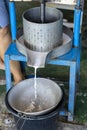 Coconut milk and juice extractor machine screw press type. Coconut milk plant in Thailand. Manual press pressing coconut for