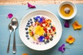 coconut milk porridge with a colorful berry medley on top