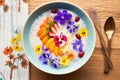 coconut milk porridge with a colorful berry medley on top