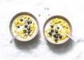 Coconut milk turmeric oatmeal porridge on a light background, top view. Gluten free, vegetarian food