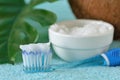 Coconut oil in a bowl with a toothbrush - Homemade whitening toothpaste