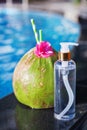 Coconut oil fresh and juice smoothie drink cocktail near swimming pool - summer exotic health holiday concept Royalty Free Stock Photo