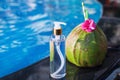 Coconut oil fresh and juice smoothie drink cocktail near swimming pool - summer exotic health holiday concept Royalty Free Stock Photo